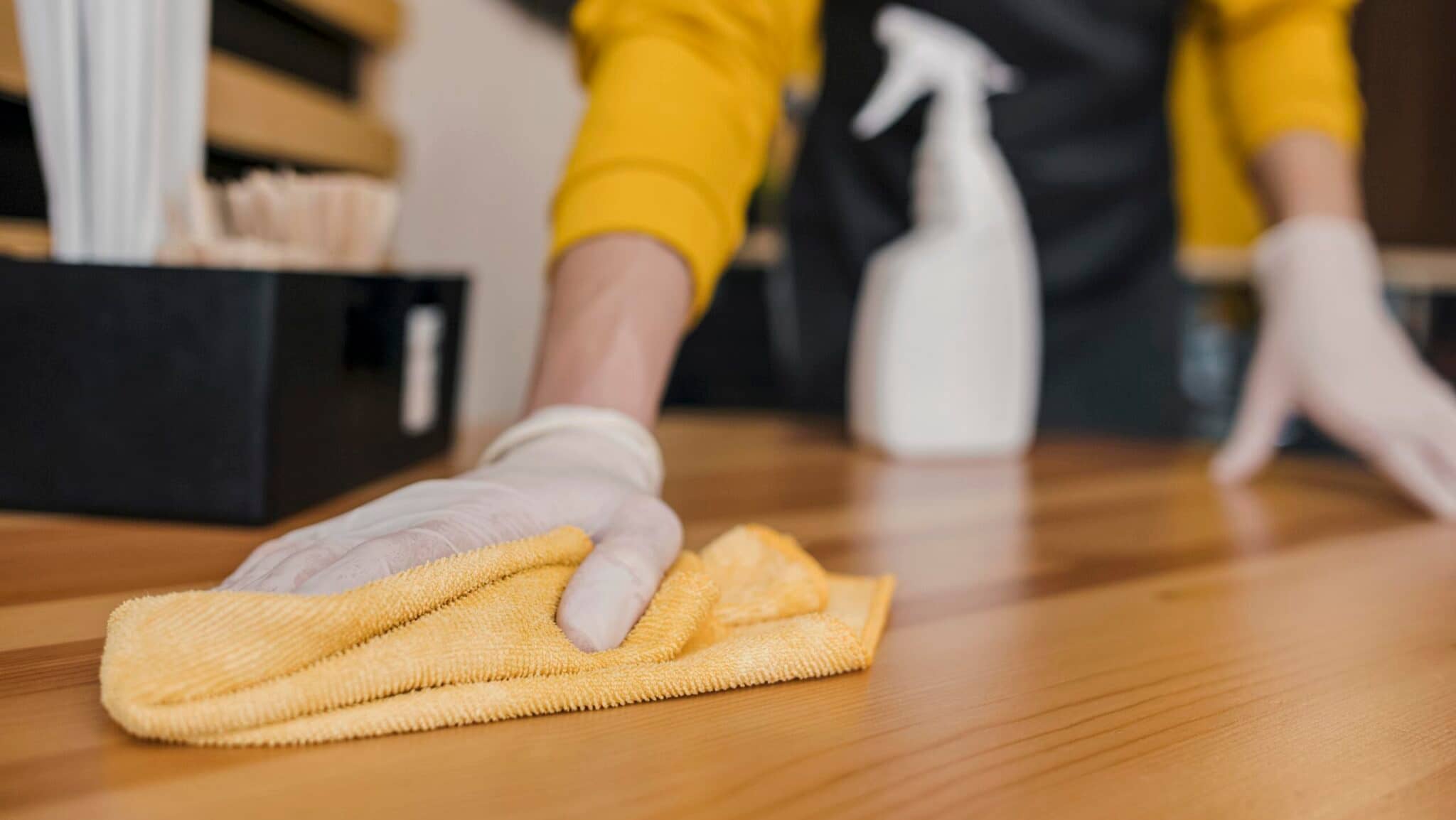 Person cleaning the floor with a cloth